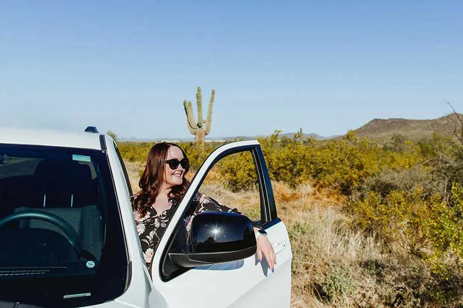 enjoying her newly refinanced SUV